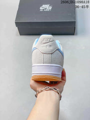 Nike Air Force 1 Low White and Blue Gum Sole Sneakers