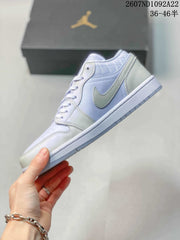 Jordan Air Jordan 1 Low Sneakers in White and Lavender