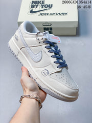 Nike Dunk Low Retro Sneakers in White and Navy