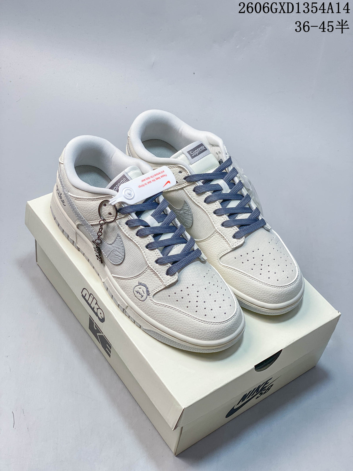 Nike Dunk Low Retro Sneakers in White and Navy
