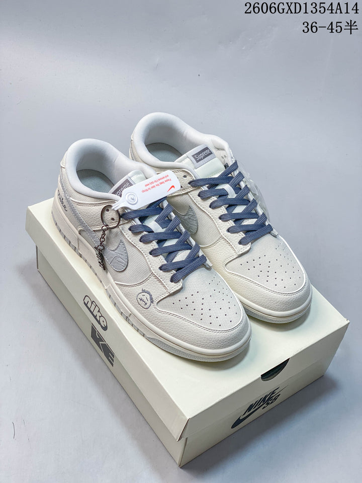 Nike Dunk Low Retro Sneakers in White and Navy