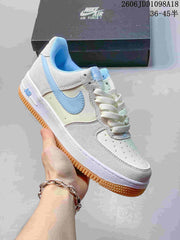 Nike Air Force 1 Low White and Blue Gum Sole Sneakers