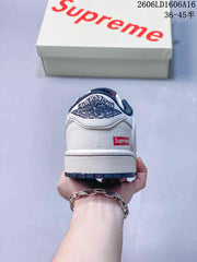 Jordan 1 Low Sneakers in White and Navy